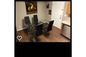 Enjoy meals in this cozy dining area with a glass-top table and four chairs.