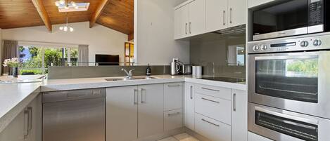 Fridge, microwave, dishwasher, cookware/dishes/utensils