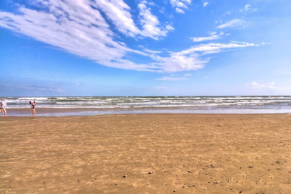 On the beach, sun-loungers, beach towels