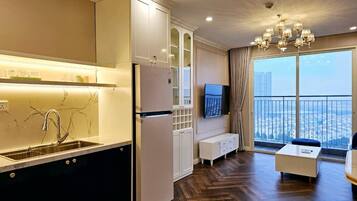 Business Apartment, 2 Bedrooms | Living area | 47-inch flat-screen TV with cable channels, TV