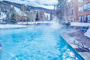 A heated pool - Ski-in/out, mountain-view condo with hot tub, pool & gym (Big Sky)