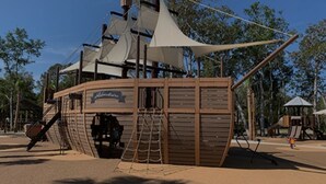 A pirate-themed play structure with a ship deck, a ladder, and a slide. - Condo Near Coligny Circle, Beach, & New Park; all within 1 to 2 Blocks (Hilton Head Island)