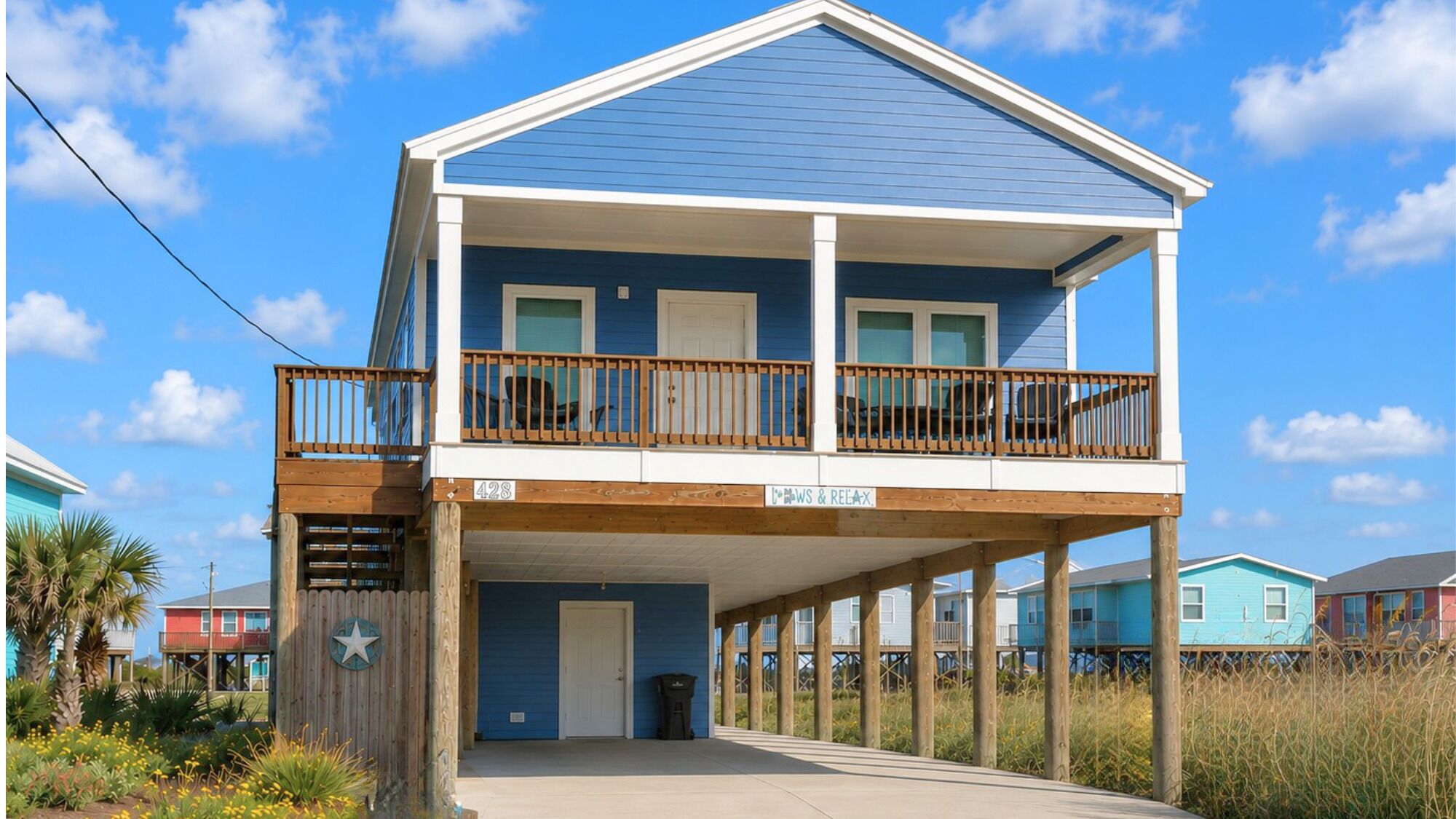 Pull up in the spacious driveway on the quiet street that dead ends at the beach