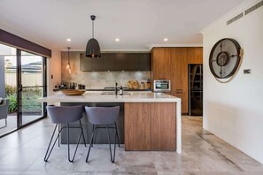 Coffee/tea maker, fridge, microwave, oven