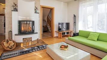 Family Chalet, 3 Bedrooms, Mountainside (Sunny Weekend Sauna House) | Living area | 21-inch flat-screen TV with satellite channels, TV, fireplace