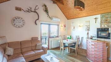 Family House, Multiple Bedrooms, Mountainside (Vineyard Cottage Bahor) | Living area | 21-inch flat-screen TV with satellite channels, fireplace, stereo