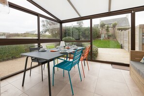 Enjoy meals in the dining area with a view of the outdoor space.