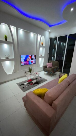 Luxury Apartment | Living room | 49-inch TV with digital channels