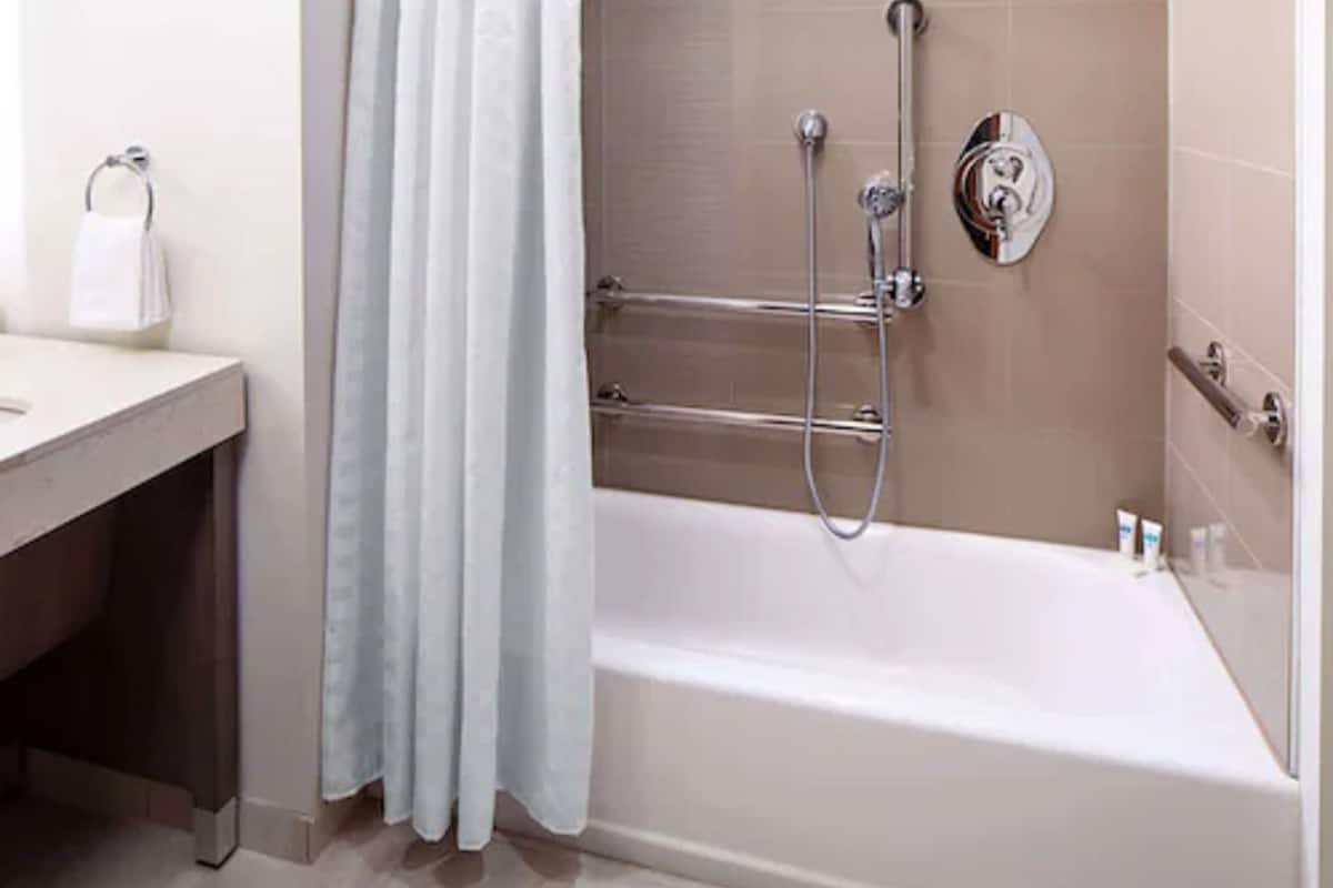 room, 1 king bed with sofa bed, accessible, bathtub | bathroom | free toiletries, hair dryer, towels, soap