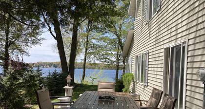 Stunning view of Hamlin Lake, w/ deck, fire-pit, screened in porch. Sleeps 6.