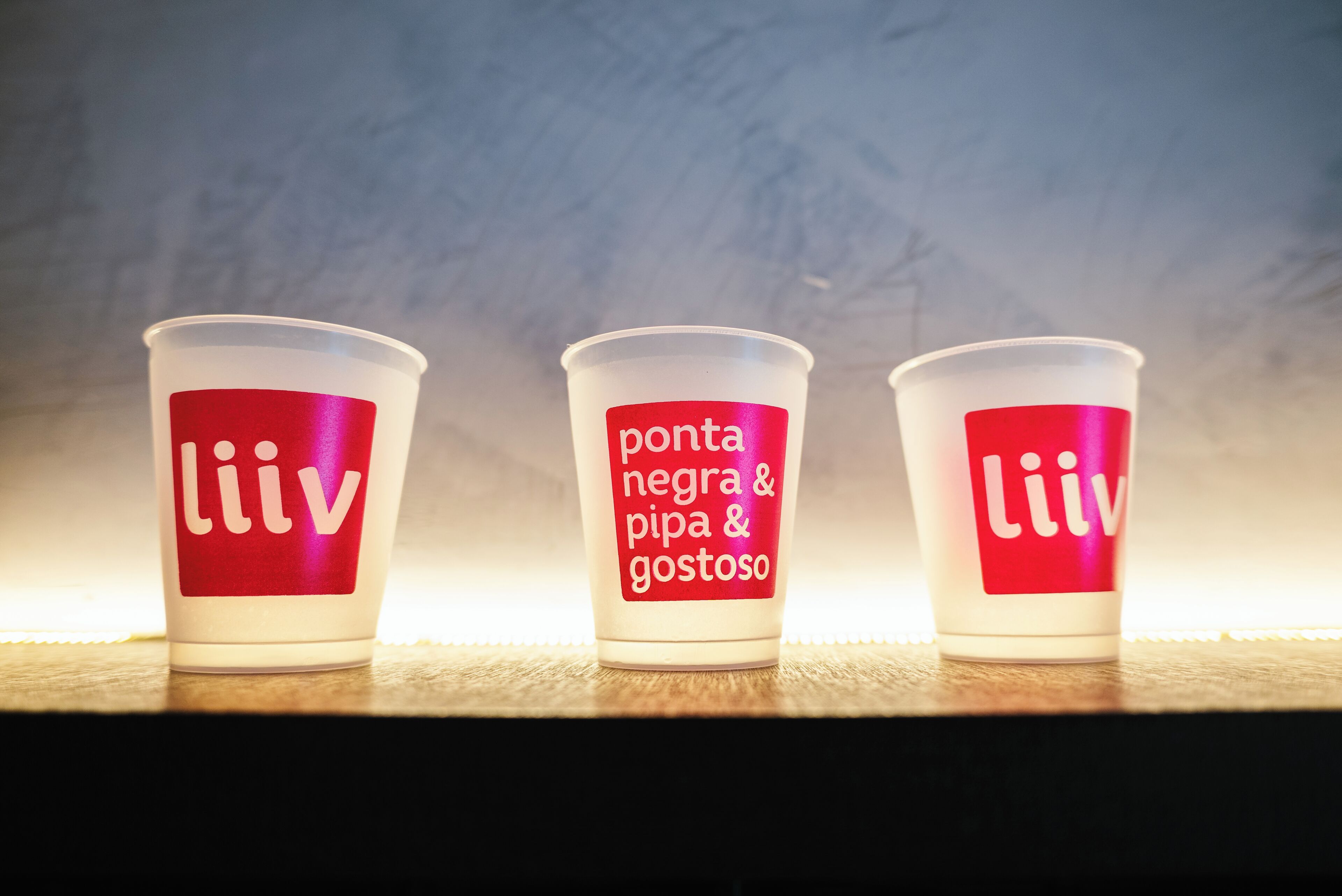 Three cups with text on them.