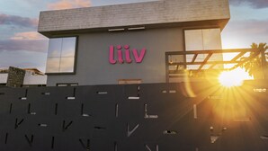 A modern building with the name "liiv" prominently displayed on its facade. - Liiv Costeira - Natal Ponta Negra (Natal)