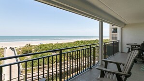 A balcony with a view of the beach and ocean. - Windjammer 209 - 2 Bedroom Oceanfront Getaway (St. Augustine)