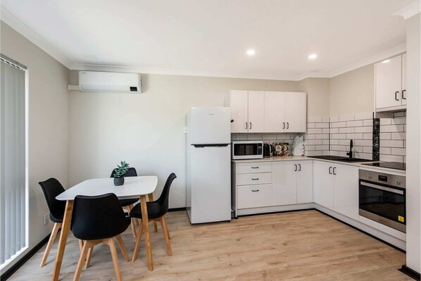Apartment (1 Bedroom) | Private kitchen | Fridge, microwave, oven, stovetop