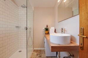 Shower, hair dryer, towels, toilet paper