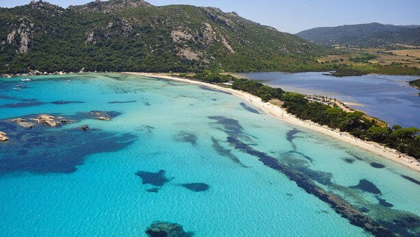 An aerial view of a coastal area with clear turquoise waters, rocky outcrops, and a sandy beach. - Santa-Giulia beach&Bergerie&U Caseddu (Porto-Vecchio)