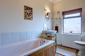 Bathtub, hair dryer, towels