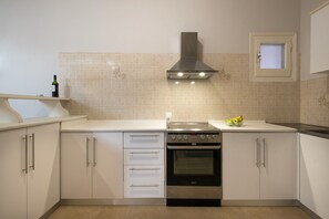 Fridge, oven, cookware/dishes/utensils