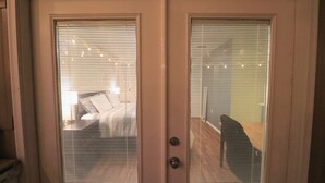 A closed door with frosted glass panels and a keyhole.