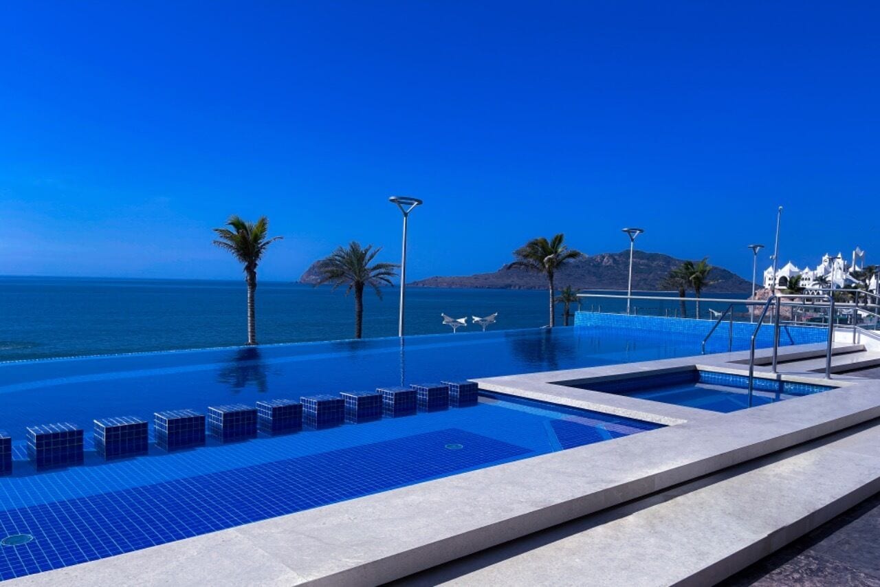 outdoor pool, pool umbrellas, pool loungers