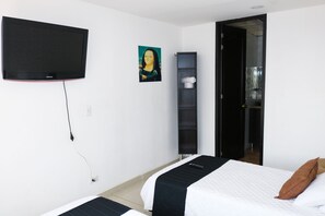 Standard Room, Multiple Beds, City View | Free WiFi, bed sheets - Hotel Casa Botero (Bogotá)