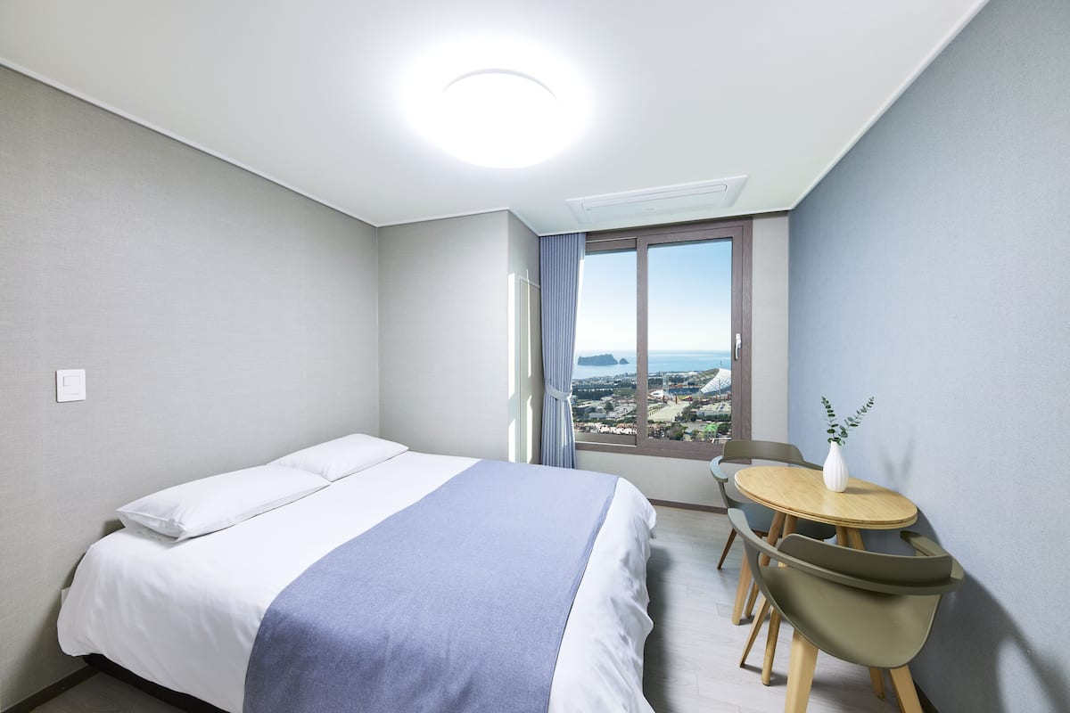 Desk, laptop workspace, blackout curtains, free WiFi