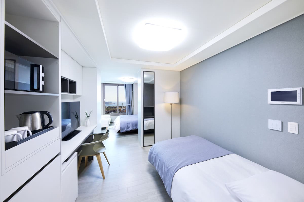 Desk, laptop workspace, blackout curtains, free WiFi