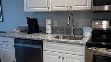 Coffee/tea maker, fridge, microwave, oven