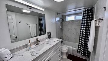 Combined shower/bathtub, hair dryer, towels, soap