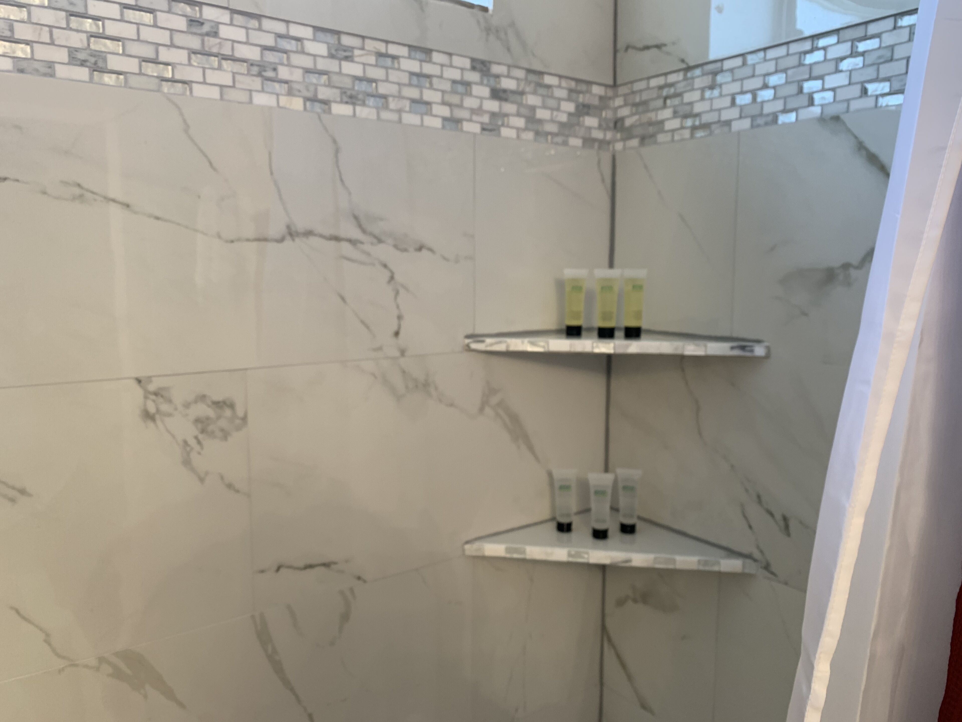 Combined shower/tub, hair dryer, towels, soap