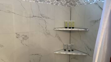 Combined shower/tub, hair dryer, towels, soap