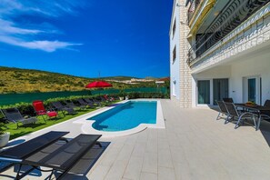 A heated pool, pool loungers