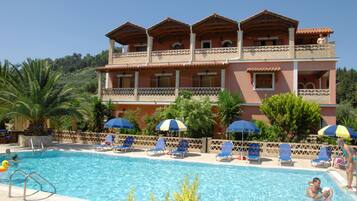Seasonal outdoor pool, open 8:00 AM to 9:00 PM, pool umbrellas