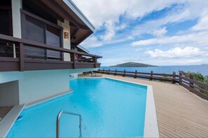 Enjoy a refreshing swim in the pool overlooking the sea with a balcony view.