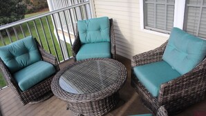 A wicker outdoor seating area with two chairs and a round table on a porch. - 3BD-2BA 2nd flr Dreamy Rehoboth Beach Getaway (Rehoboth Beach)