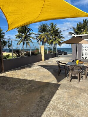 Outdoor dining - Change your Latitude ~ Studio~ Only Steps from the beach/ocean (Luquillo)