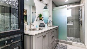 Combined shower/tub, hair dryer, towels, soap