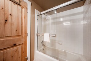 Combined shower/bathtub, hair dryer, towels, soap