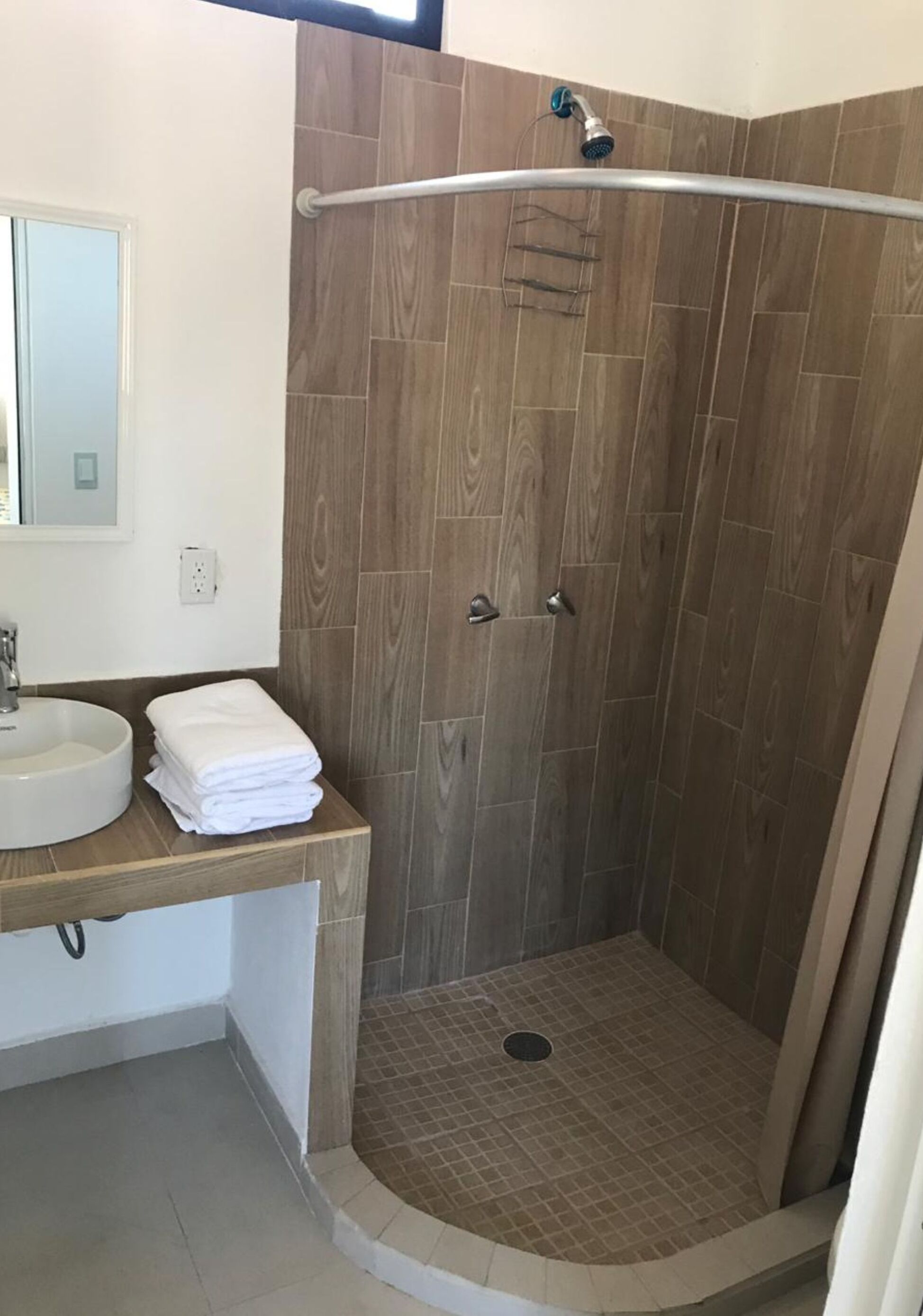 Shower, rainfall showerhead, towels, soap