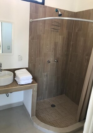 Shower, rainfall showerhead, towels, soap