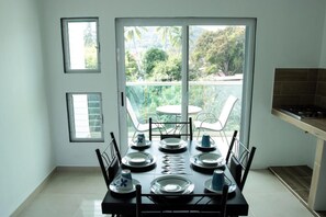 Junior Suite with Balcony | Private kitchen | Full-sized fridge, microwave, stovetop, blender - Hotel Rega Suites Guayabitos - Family & Kitchen (Rincón de Guayabitos)