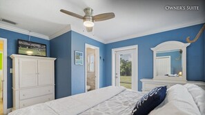 Classic bedroom with a bed, ceiling fan, and storage cabinet, offering a comfortable retreat.