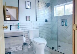 Combined shower/tub, hair dryer, towels, soap