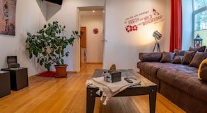 Family Apartment (Villa Kunterbunt 1) | Living area | Flat-screen TV
