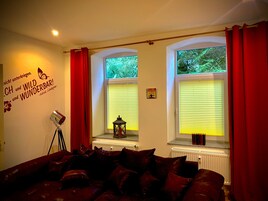 Family Apartment (Villa Kunterbunt 1) | Living area | Flat-screen TV
