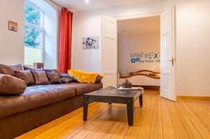Family Apartment (Villa Kunterbunt 1) | Living area | Flat-screen TV