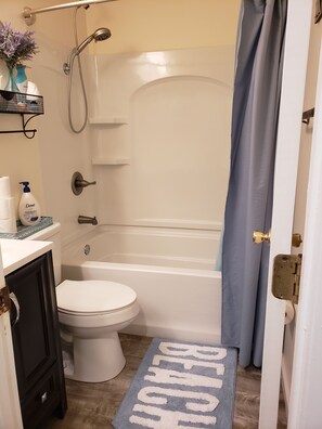 Combined shower/bathtub, hair dryer, towels, soap