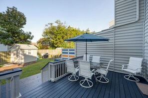 Enjoy dining or socializing on the deck with a glass-top table and four comfortable chairs.