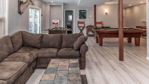 A living room with a sectional sofa, a foosball table, and a pool table. - SLOPESVIEW 4,400sq ft ~ 3 Level Home~ 6 BR,4BA, Sleeps 16~ Games!Walk to slopes! (Lake Harmony)