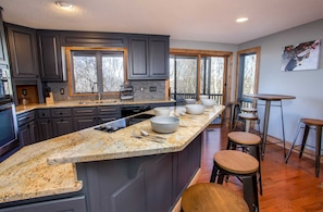 Enjoy cooking in this well-equipped kitchen with an oven, stovetop, and sink.